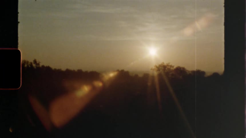The sun moves in an arc across the horizon