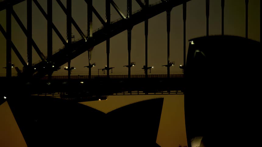 Time lapse of bridge in city downtown at sunset