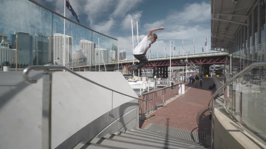 A man skates over the stairs