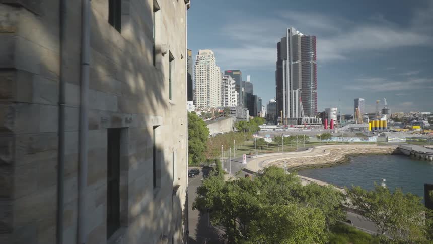 Aerial view of the city with tall buildings next to the sea