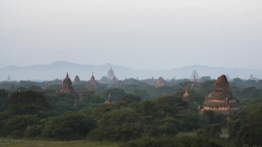 Fog obscures mountains on horizon near site of historical pagoda