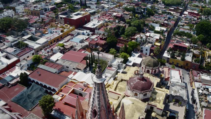 An aerial view of a neighborhood with houses is displayed