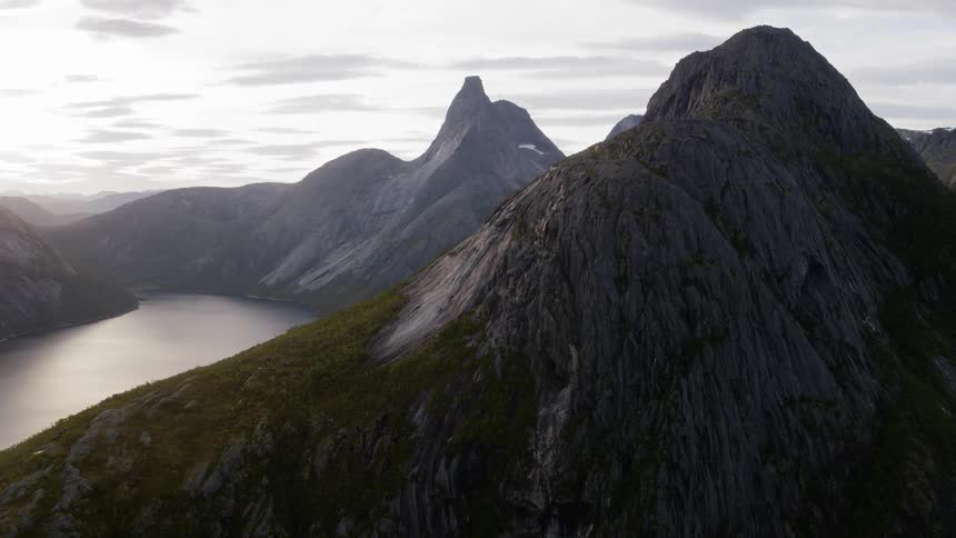 Mountains rise over a body of water