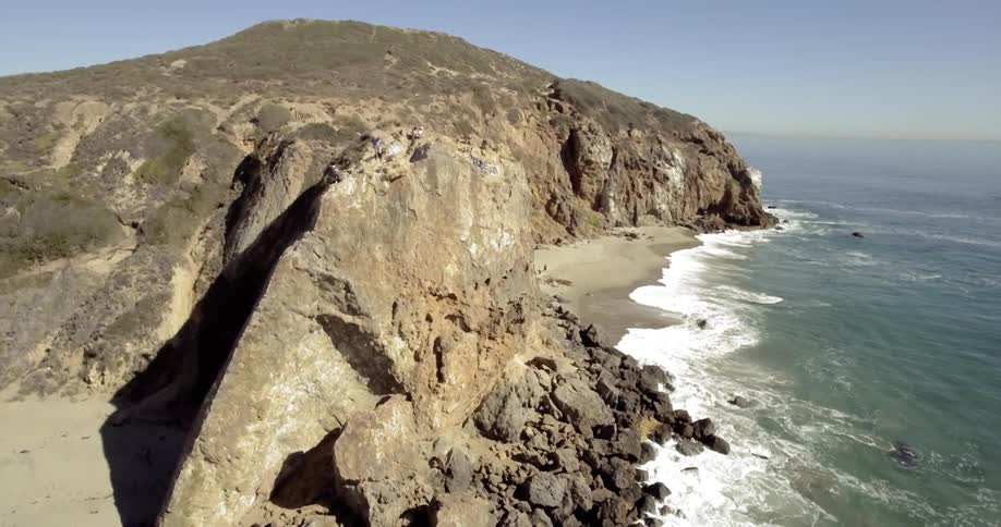 Waves crashing on the shoreline in a cove on the coast
