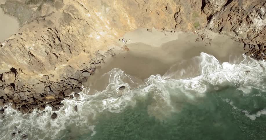 The waves crash onto the beach