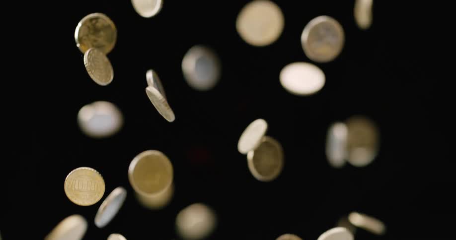 Coins fly up into the air