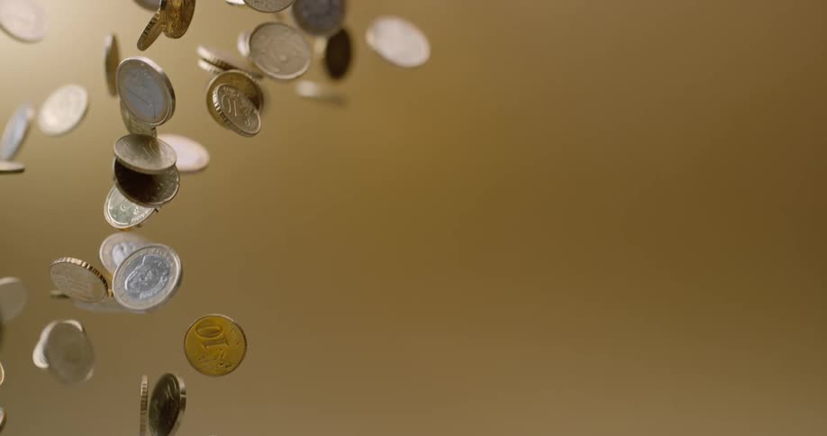 Coins fly up in the air and then fall back down