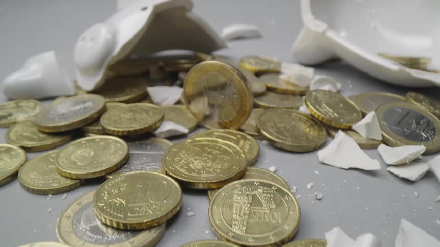 Currency is displayed next to a broken piggy bank