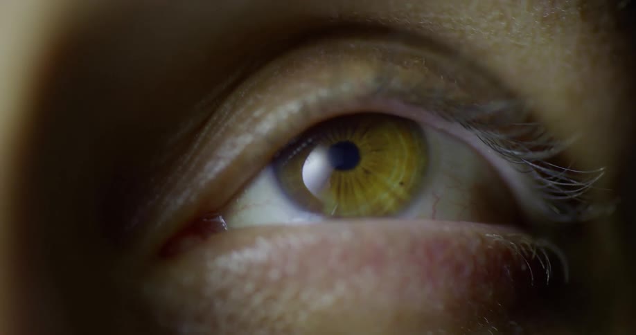 An eyeball moves in a socket and occasionally blinks