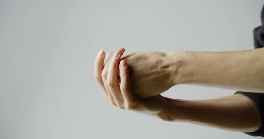 Hands displaying proper use of applying hand sanitizer