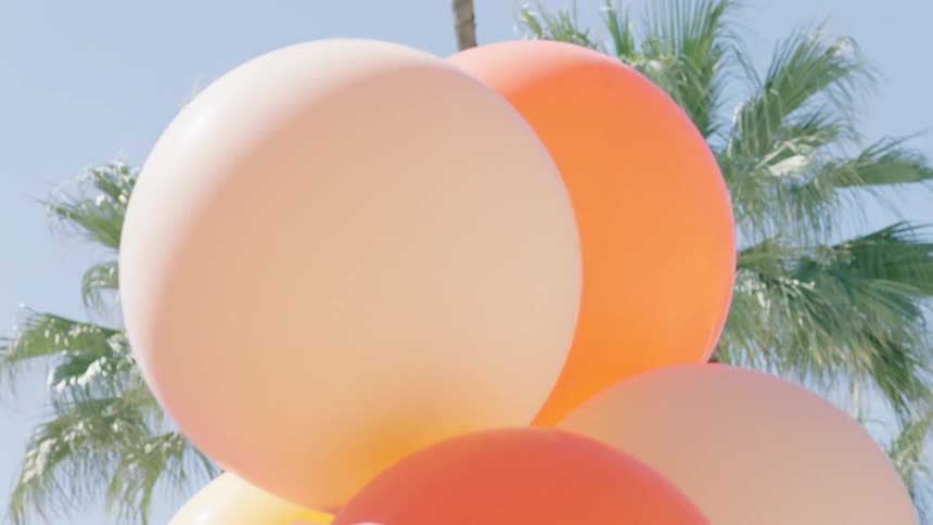 Several balloons are inflated with helium
