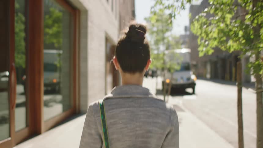Woman walks down the empty street during coronavirus lockdown