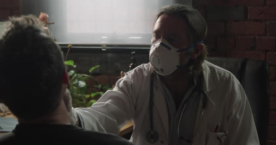 The doctor checks the patient