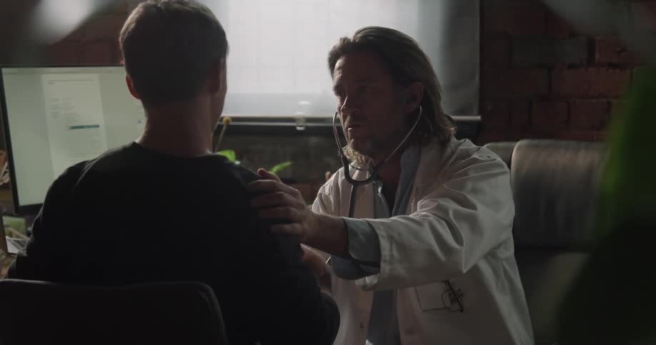 The doctor checks over his patient