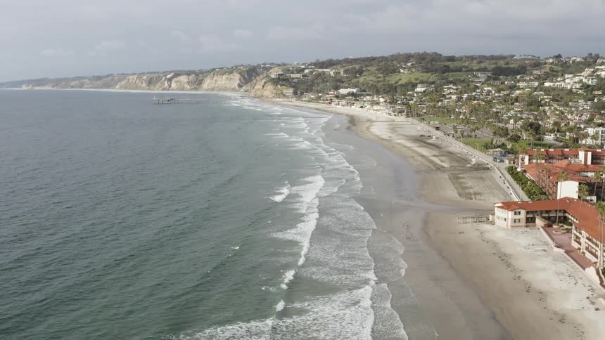 The waves crash into the shoreline