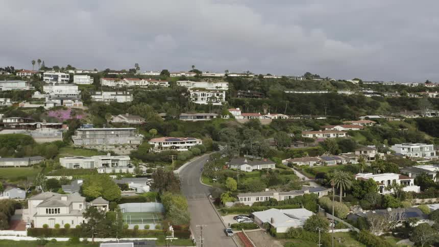 A neighborhood with homes built into the hills on a cloudy day