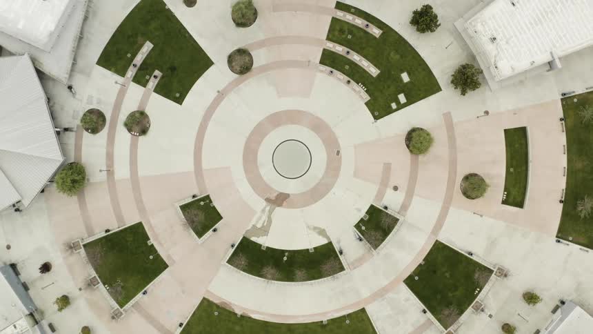 An outdoor courtyard with pathways forming geometric shapes