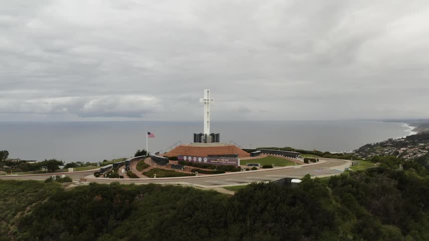 The cross stands tall on the church