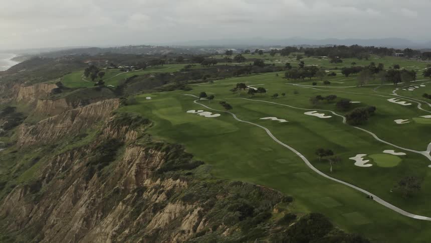A golf course stretches out over the landscape