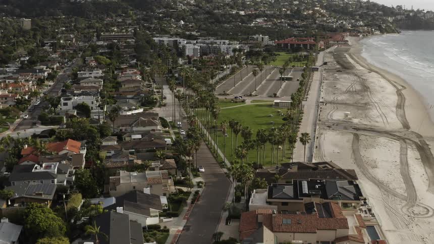 Empty beaches parking lots and park along the shore of a coastal neighborhood