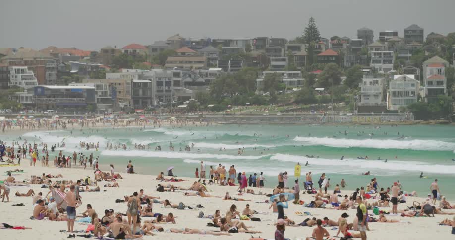 People relax at the beach
