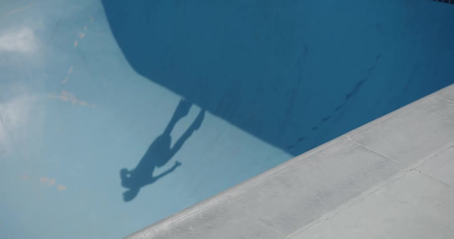A person with inline skates skating in a skate park