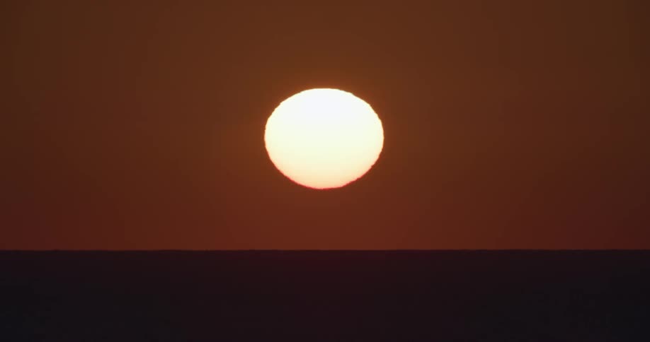 The sun sits on the horizon