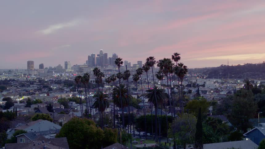 The sun sets over a neighborhood near downtown