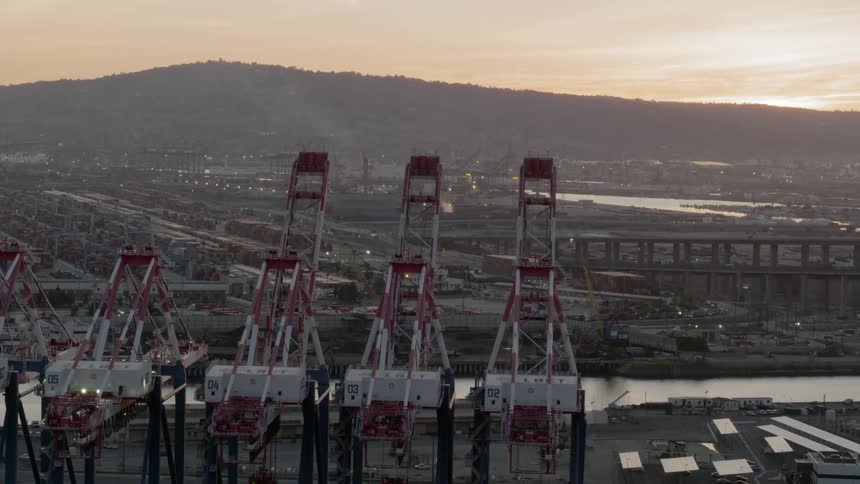 Container cranes on a shipyard in the evening