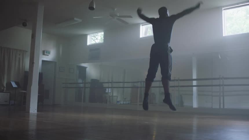 A man works out in the empty room