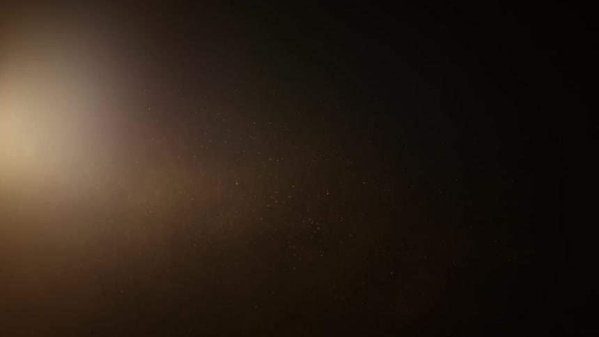 Particles move in front of a bright source of light