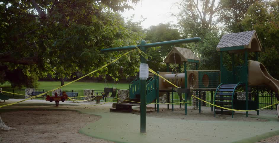 Caution tape covering a public playground during coronavirus
