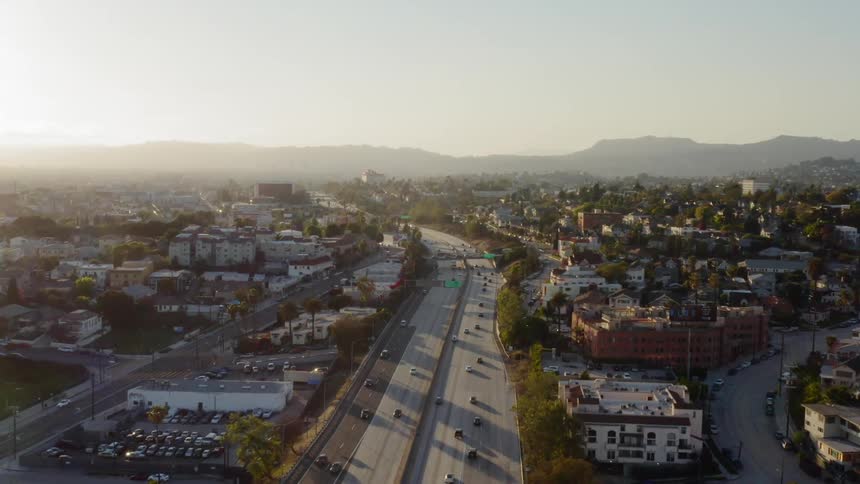Many vehicles travel a highway through Los Angeles