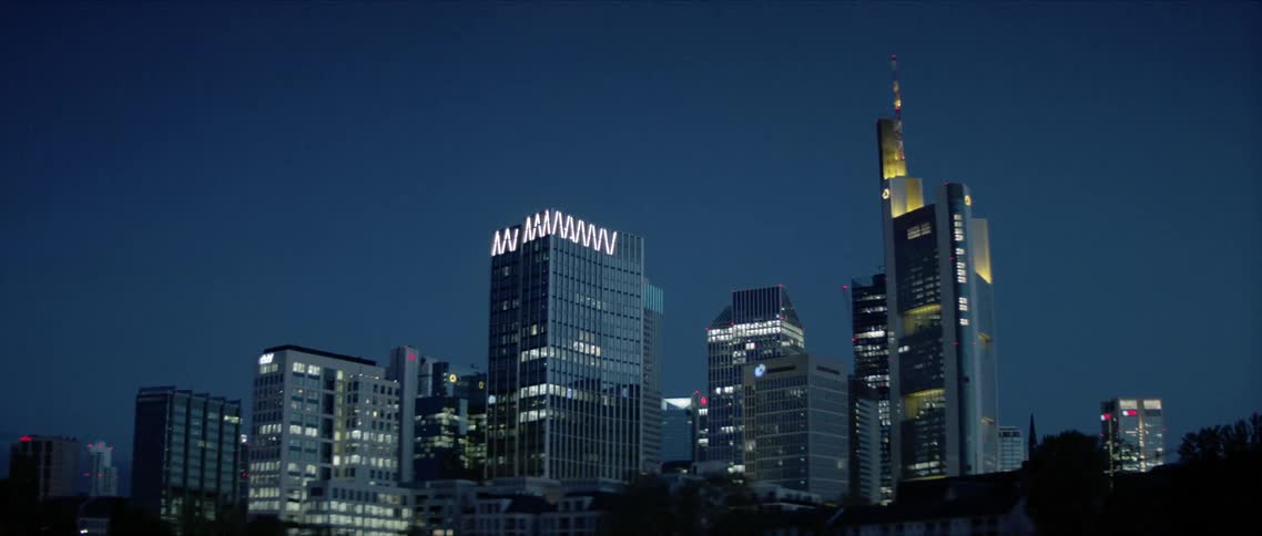 Lights shine out of sky scrapers in a city