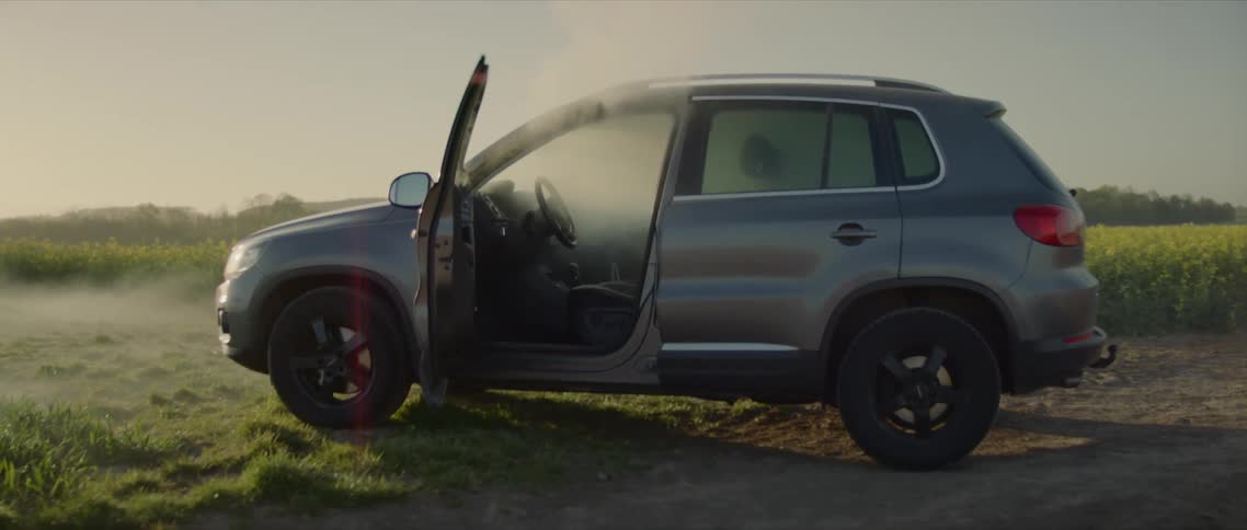 Smoke billows out of an empty car