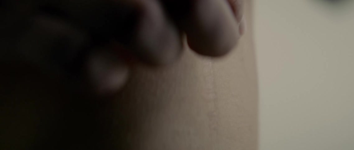 A person is rubbing their hand over their skin