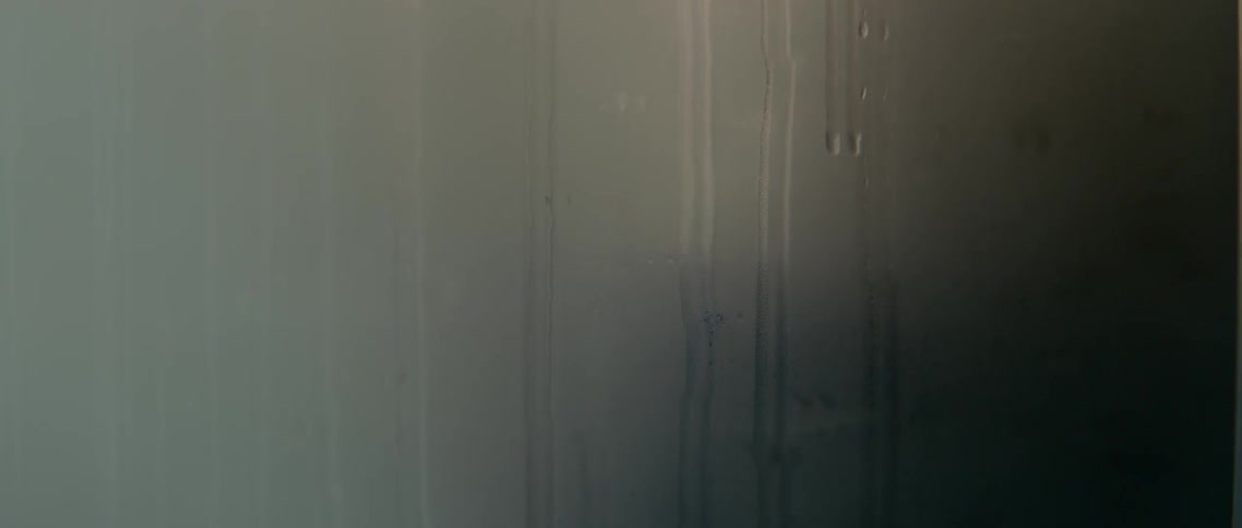 Water drips down a wall
