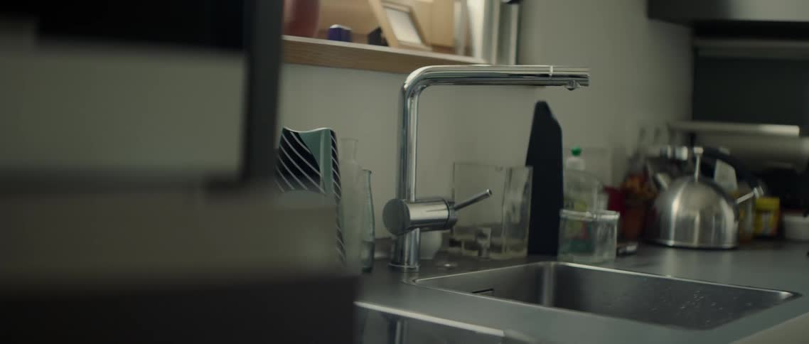 Water drips from the tap in the kitchen