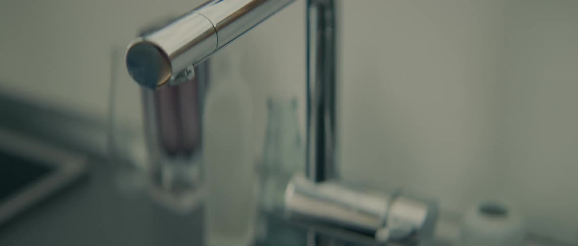 The faucet slowly leaks in the sink