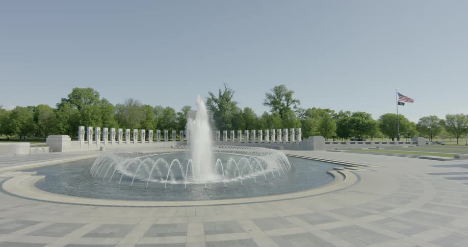 A monument with a water fountain and pillars