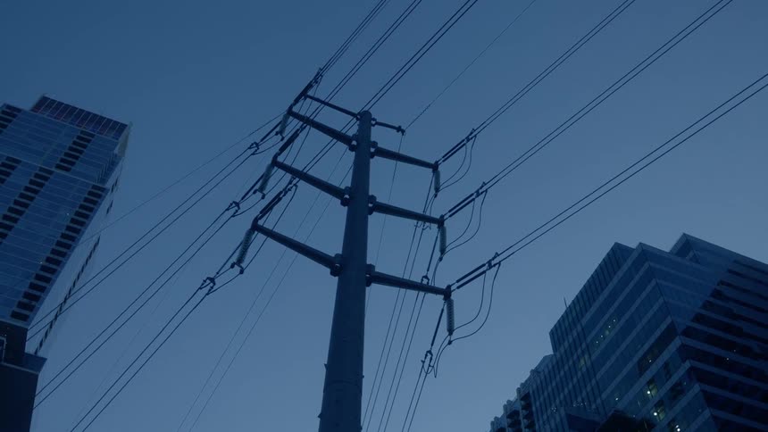 A city with buildings and electrical wires