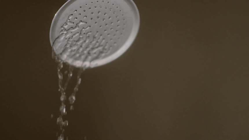 Water falls out of a shower head