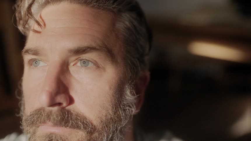 Light shines on a mans face
