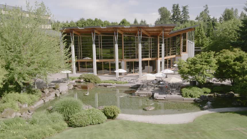 People sitting outside at an office park courtyard