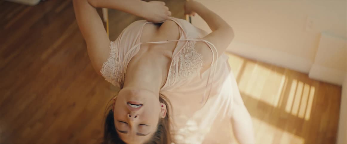 A woman bends to dance