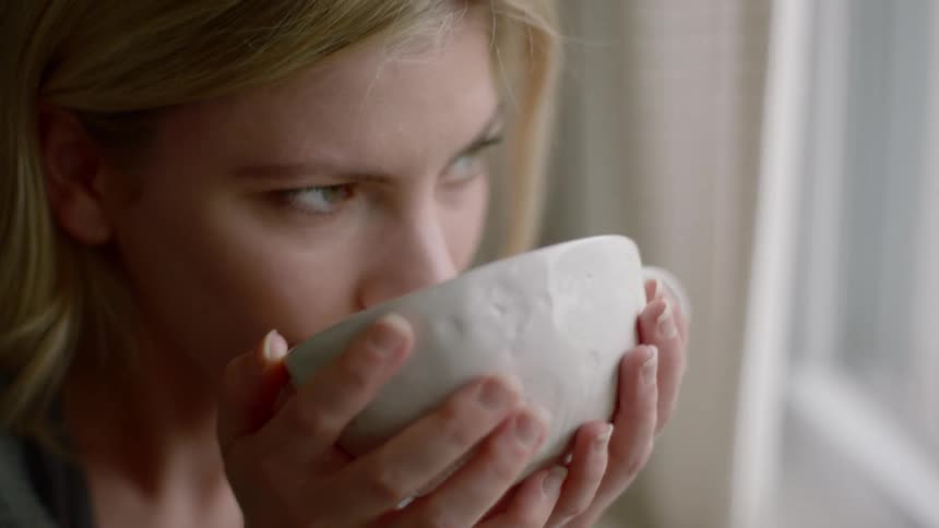 A woman drinking coffee