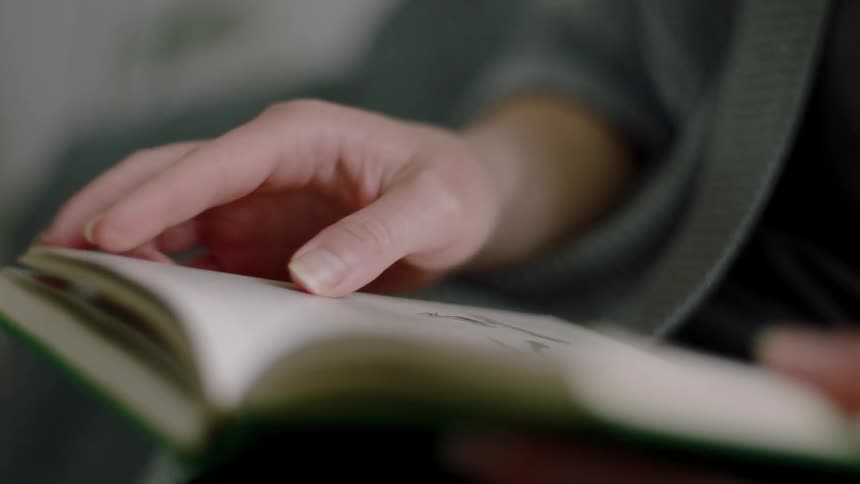 A woman reads a book