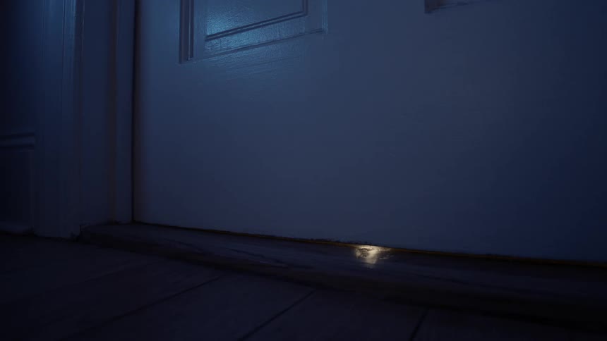Lights flashing under closed door at night