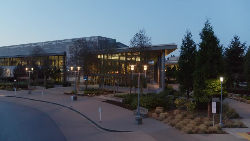 Revealing the front entrance of a modern office park at dawn