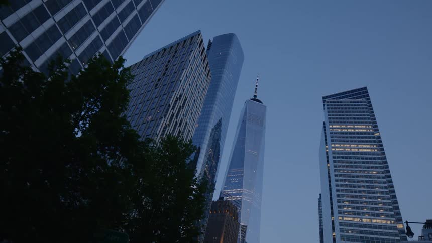 Skinny tall city skyscrapers at dusk